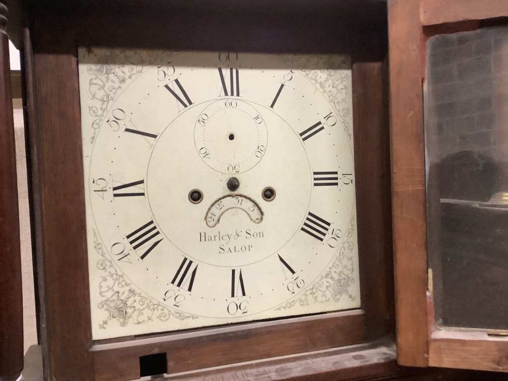 An early 19th century oak eight day longcase clock marked Harley & Son, Salop, together with two oak and mahogany clock cases